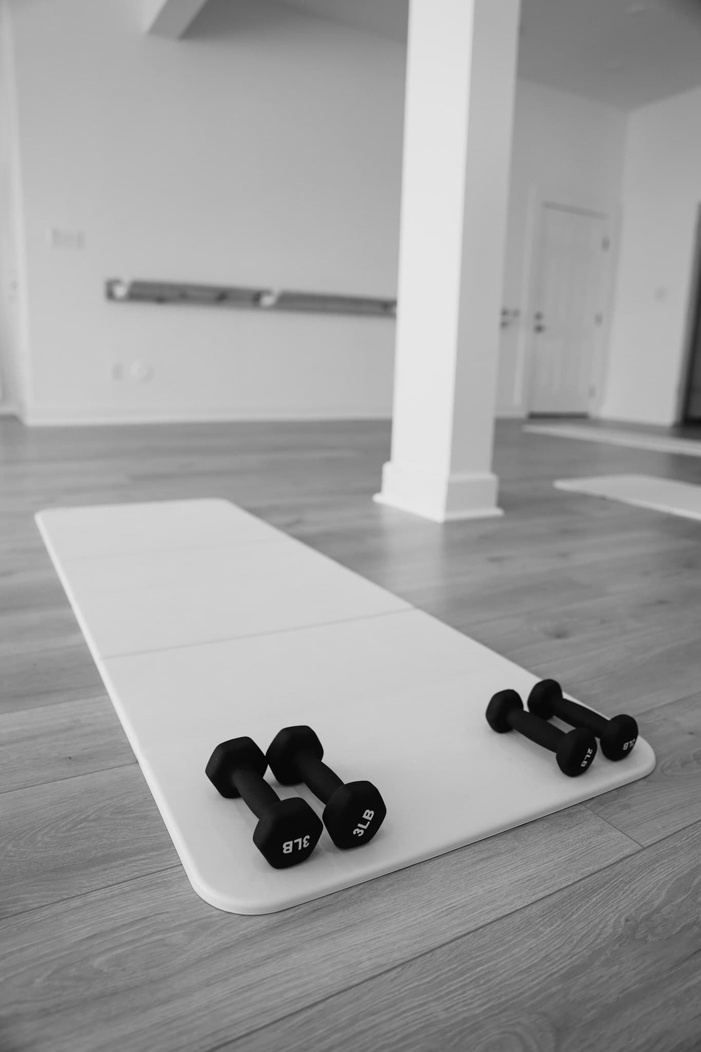 Participants stretching during a class at Empower Fitness Studio